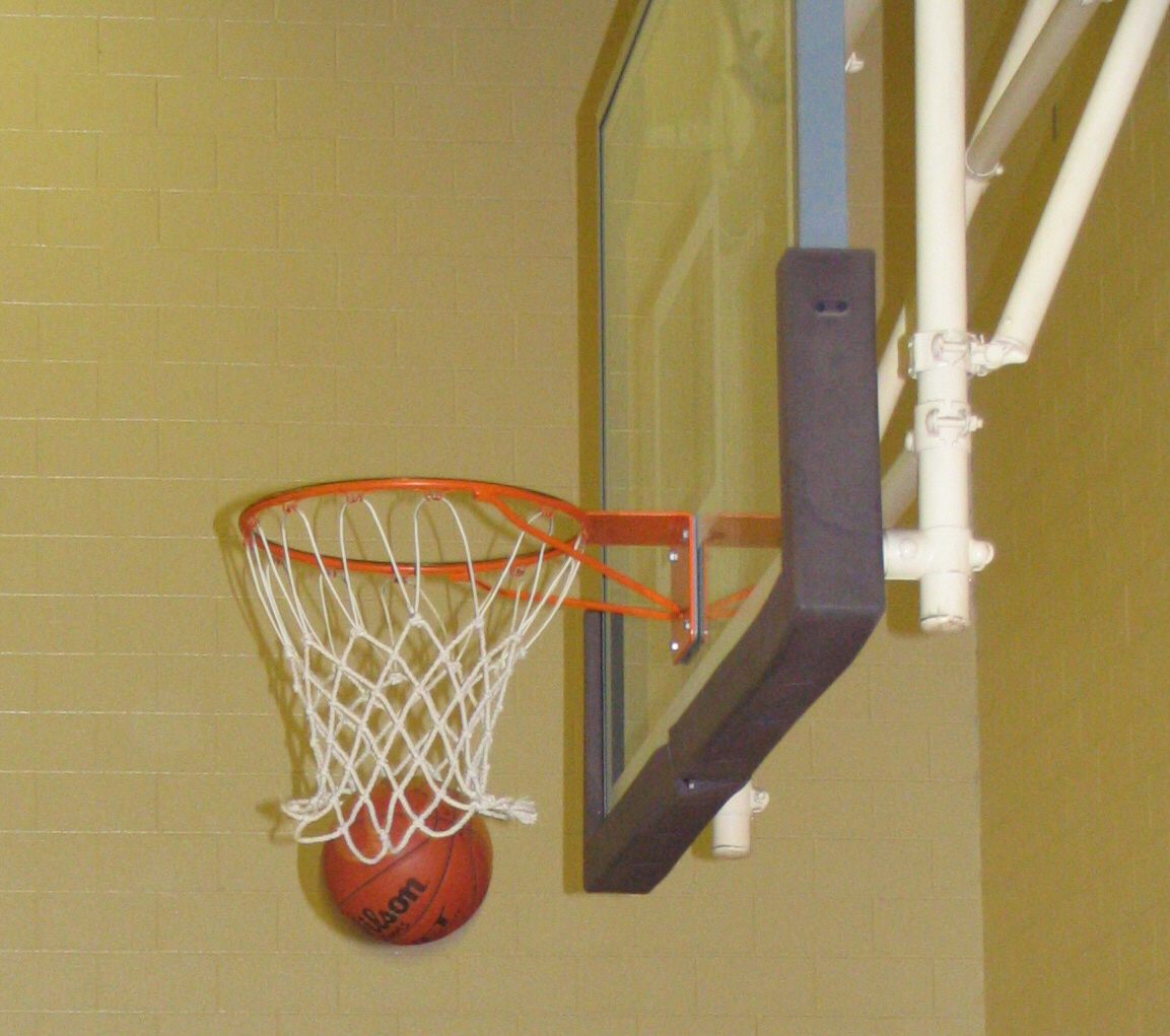 a photograph of a basketball going through the hoop