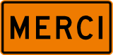 An orange road sign that says, “Merci.”