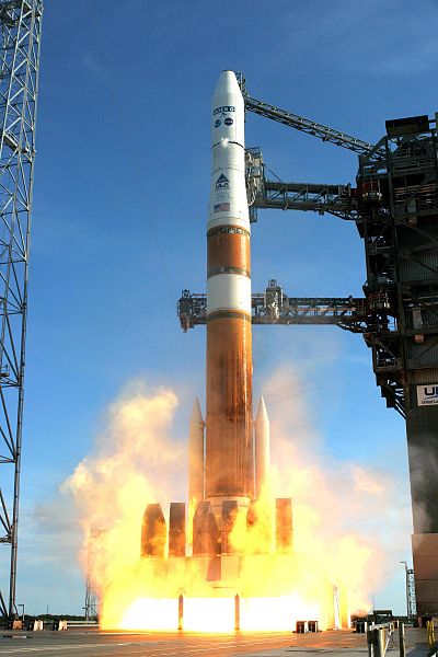 A color photograph of a spaceship lifting off.