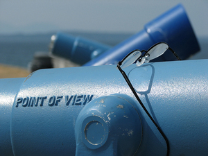 A photograph of a telescope with the words “Point of View” on the side of the viewer.