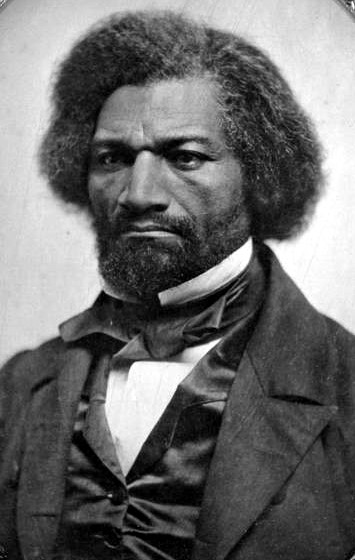 A photograph/portrait of Civil Rights activist and author Frederick Douglass. He is wearing formal men’s attire typical of the 19th century.