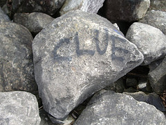 photo of a rock on which someone has written “Clue”