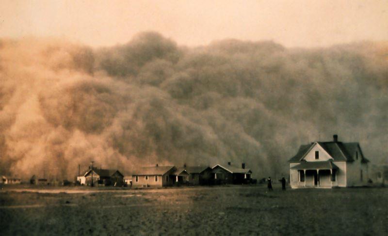 A photograph of a dust storm nearing a settlement in Texas, 1935