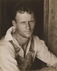 A photograph of a male sharecropper in the 1930s; He is a man in his 20s or 30s.