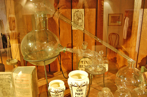 A photograph of antique, glass alchemy lab equipment