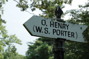 A photograph of an arrow sign that reads “O. Henry (W.S. Porter).