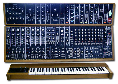 A photograph of a MOOG synthesizer. It is a key board and a mixing board.