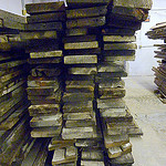 A stack of lumber in a lumber yard