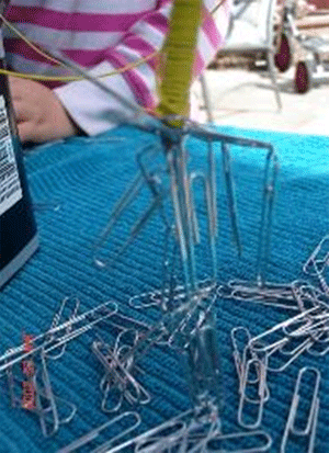 coil of wire picking up paper clips