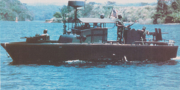 A photograph of a US Navy patrol boat from the Vietnam Era