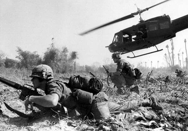 A photograph of a helicopter lifting off after dropping off troops in Vietnam